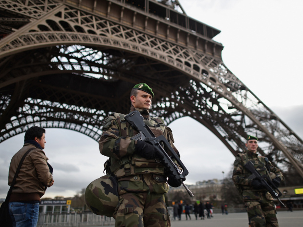 PARIS, FRANCE - JANUARY 12:  French troops patrol around the Eifel Tower on January 12, 2015 in Paris, France. France is set to deploy 10,000 troops to boost security following last week's deadly attacks while also mobilizing thousands of police to patrol Jewish schools and synagogues.  (Photo by Jeff J Mitchell/Getty Images) *** BESTPIX ***